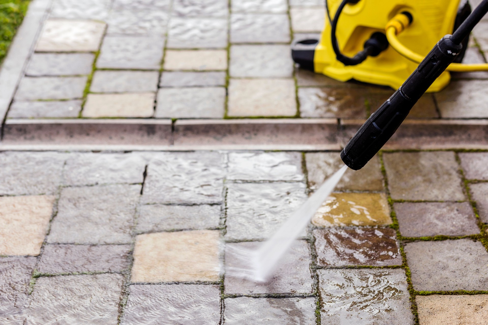 Cleaning Paving Stones in Garden with Pressure Washer